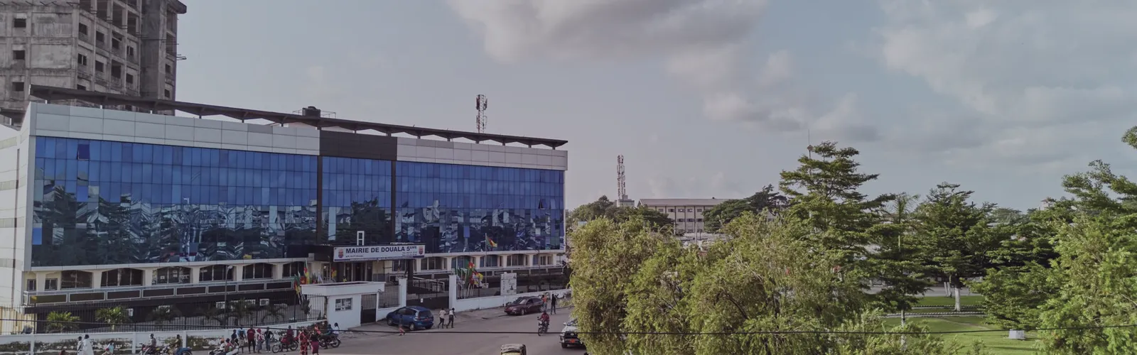 Street-level view of Douala, an office building in the foreground